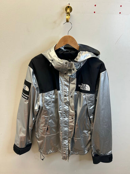 Preowned Supreme Silver TNF Windbreaker sz.Large