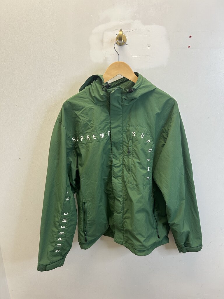 Preowned Supreme Green Spell Out Hooded Windbreaker size L